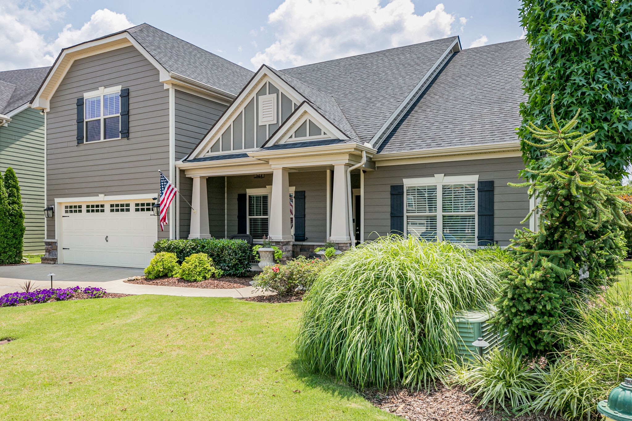 911 Contessa Drive Murfreesboro, TN 37128 - Photo 3 of 42 a front view of a house with garden