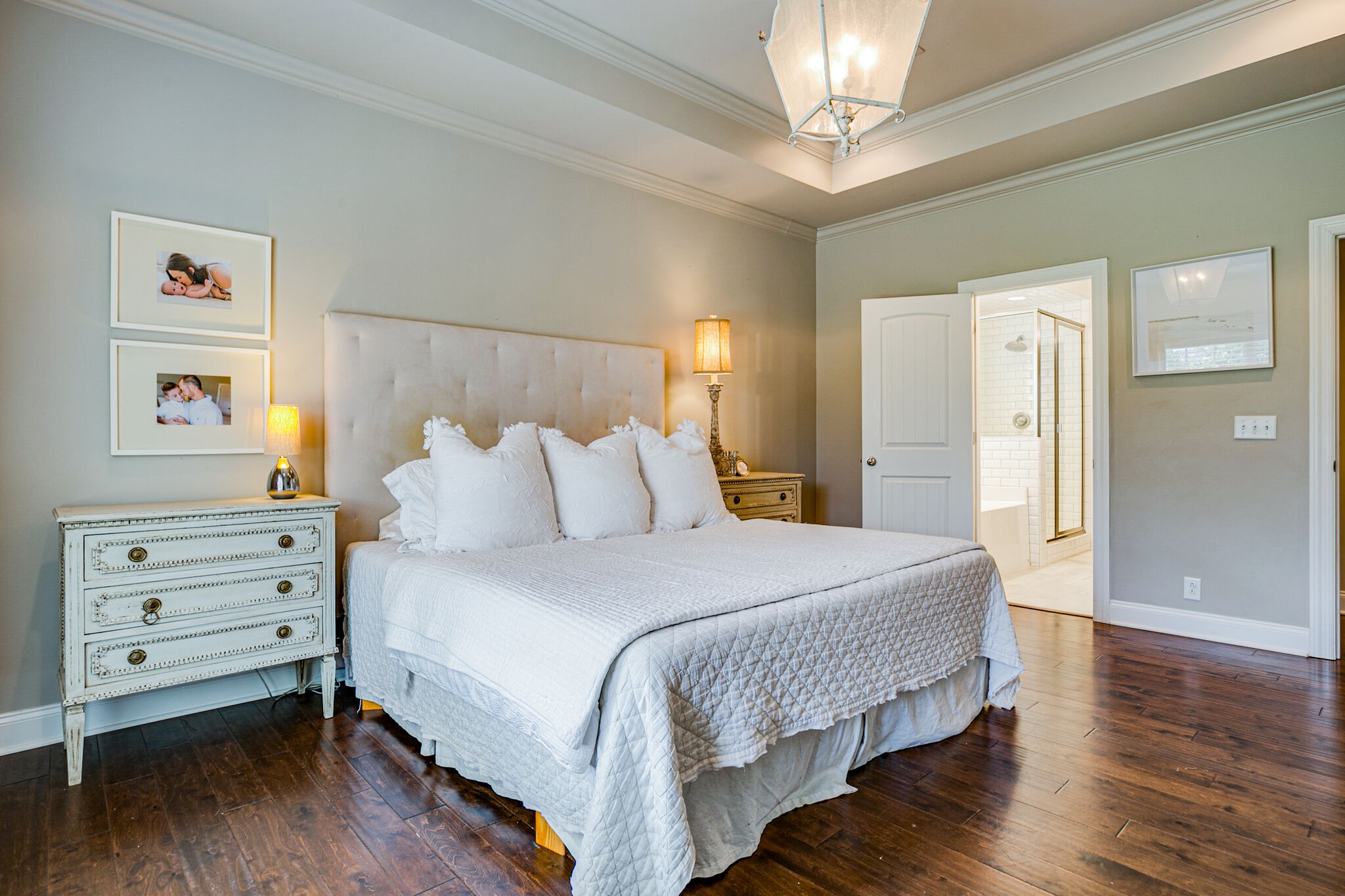 911 Contessa Drive Murfreesboro, TN 37128 - Photo 24 of 42 a bedroom with a bed and a chandelier