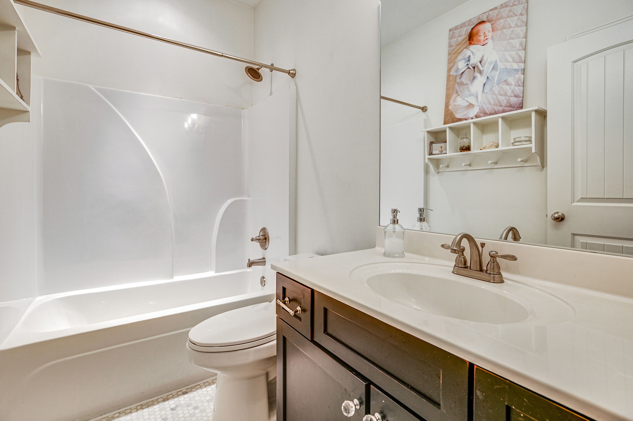 911 Contessa Drive Murfreesboro, TN 37128 - Photo 33 of 42 a bathroom with a sink a toilet and a bathtub