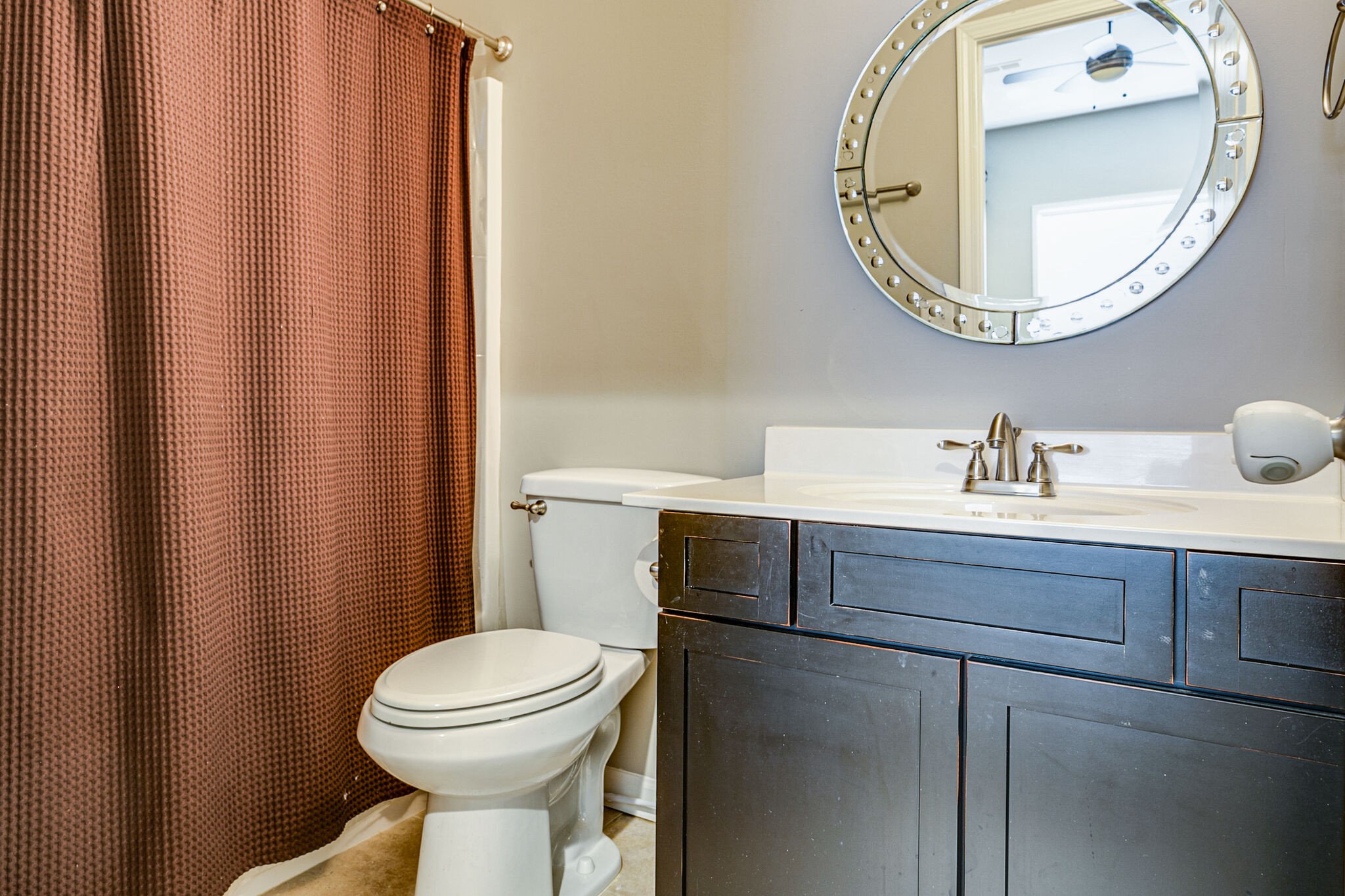 911 Contessa Drive Murfreesboro, TN 37128 - Photo 37 of 42 a bathroom with a sink a mirror a toilet and a mirror