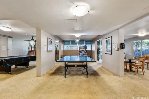 a view of a livingroom with furniture and a table