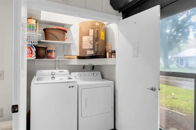 a utility room with dryer and washer