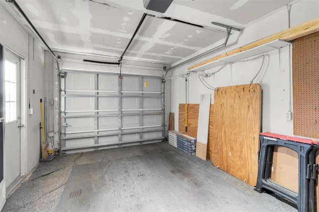 a view of a room with wooden walls and windows