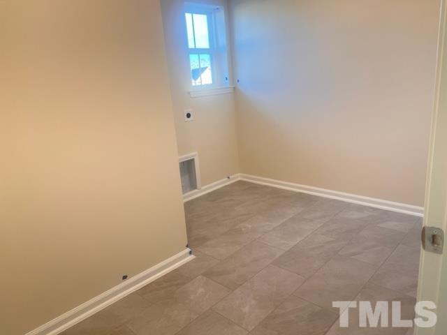 128 Katrine Way Raleigh, NC 27603 - Photo 13 of 19 an empty room with windows