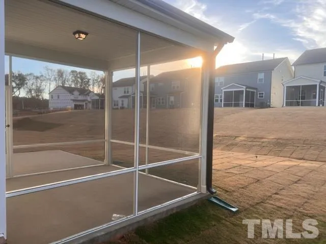 a view of a room with a glass door