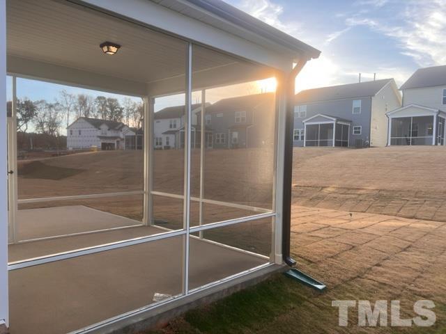 128 Katrine Way Raleigh, NC 27603 - Photo 16 of 19 a view of a room with a glass door