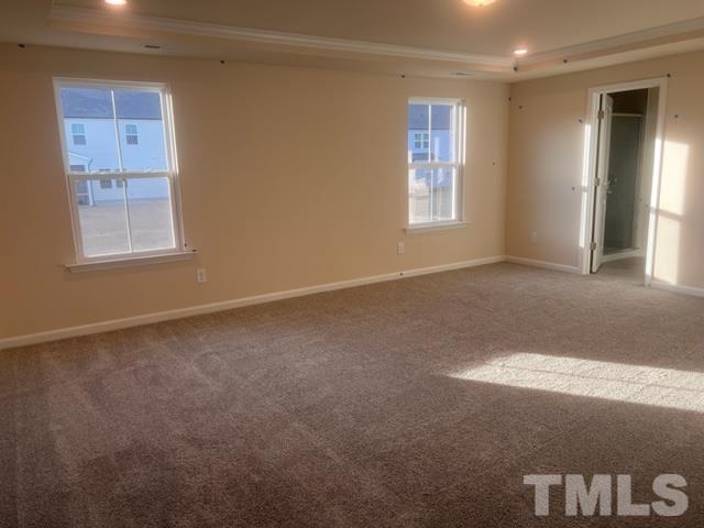 128 Katrine Way Raleigh, NC 27603 - Photo 7 of 19 a view of an empty room with a window