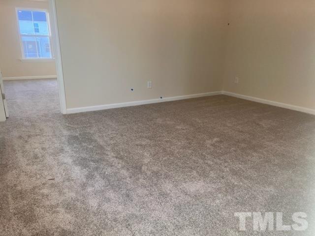 128 Katrine Way Raleigh, NC 27603 - Photo 8 of 19 an empty room with a natural light