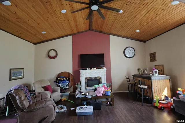 a livingroom with furniture and a fireplace