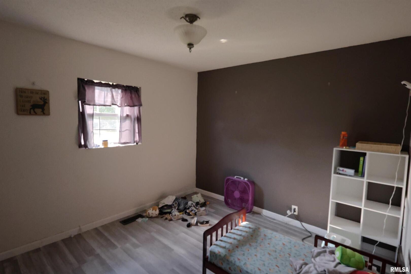 290 West 3rd Street Bonnie, IL 62816 - Photo 17 of 28 a room with furniture and wooden floor