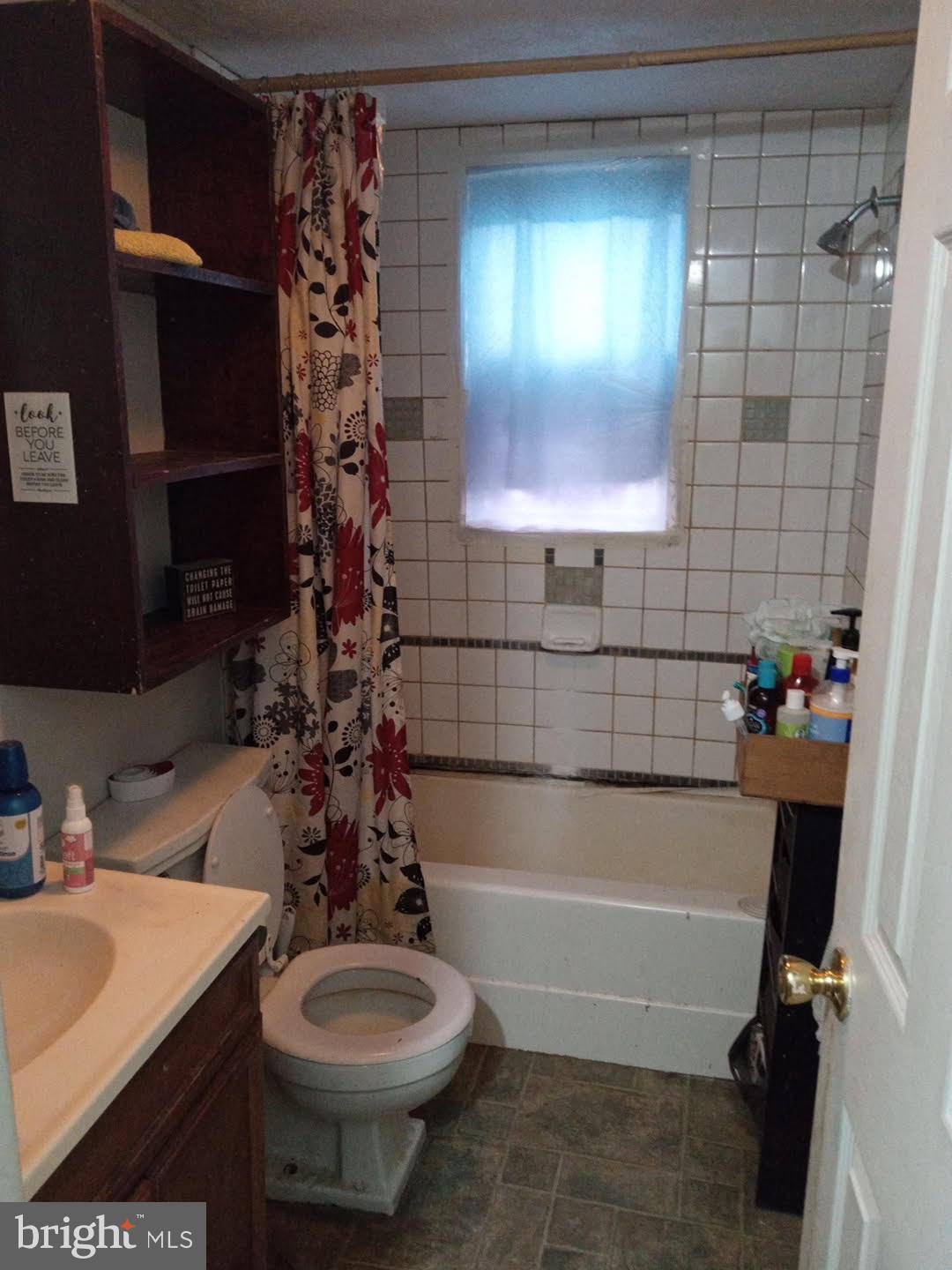 68 Mountain Road Augusta, WV 26704 - Photo 9 of 23 a bathroom with a sink a toilet and bathtub
