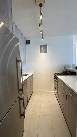a white kitchen with a sink