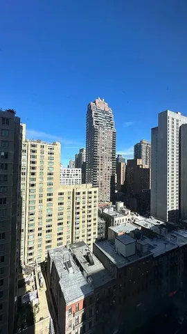 a bathroom with a shower sink and mirror