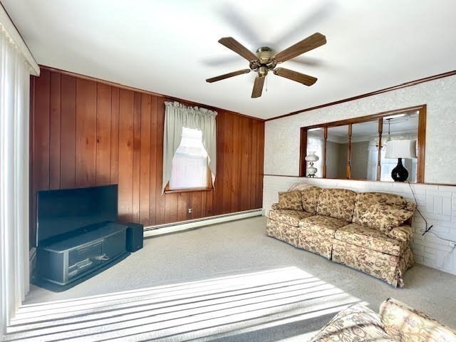 42 Smiths Lane Kingston, MA 02364 - Photo 12 of 39 a living room with a bed furniture and a large window