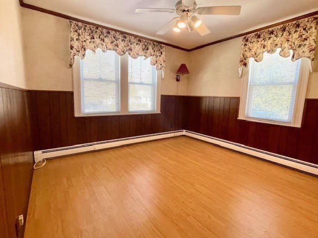 42 Smiths Lane Kingston, MA 02364 - Photo 19 of 39 a view of an empty room with a window and wooden floor