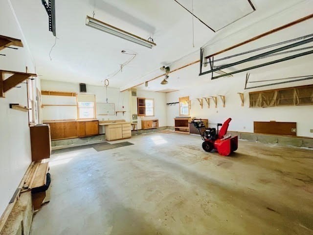 42 Smiths Lane Kingston, MA 02364 - Photo 37 of 39 a living room with furniture gym equipment and a chandelier