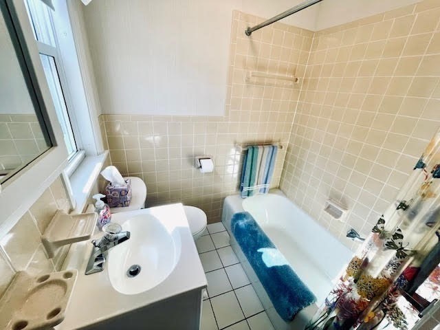 42 Smiths Lane Kingston, MA 02364 - Photo 9 of 39 a bathroom with a sink and mirror with bathtub