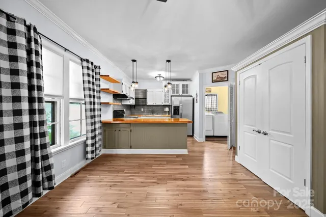 a kitchen with stainless steel appliances granite countertop a sink and cabinets