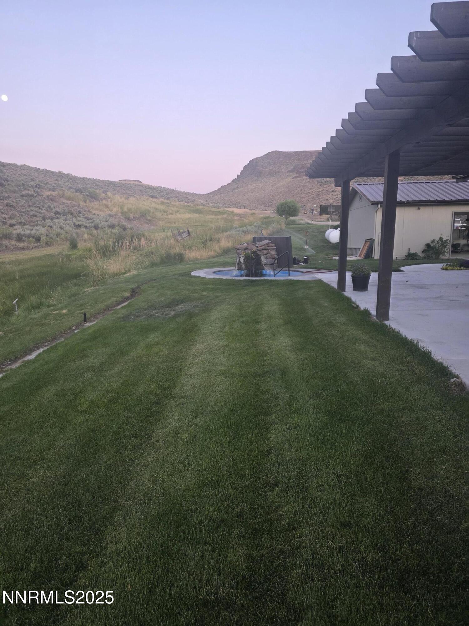 3300 High Rock Road Gerlach, NV 89412 - Photo 19 of 57 a view of a big yard with a mountain in the background