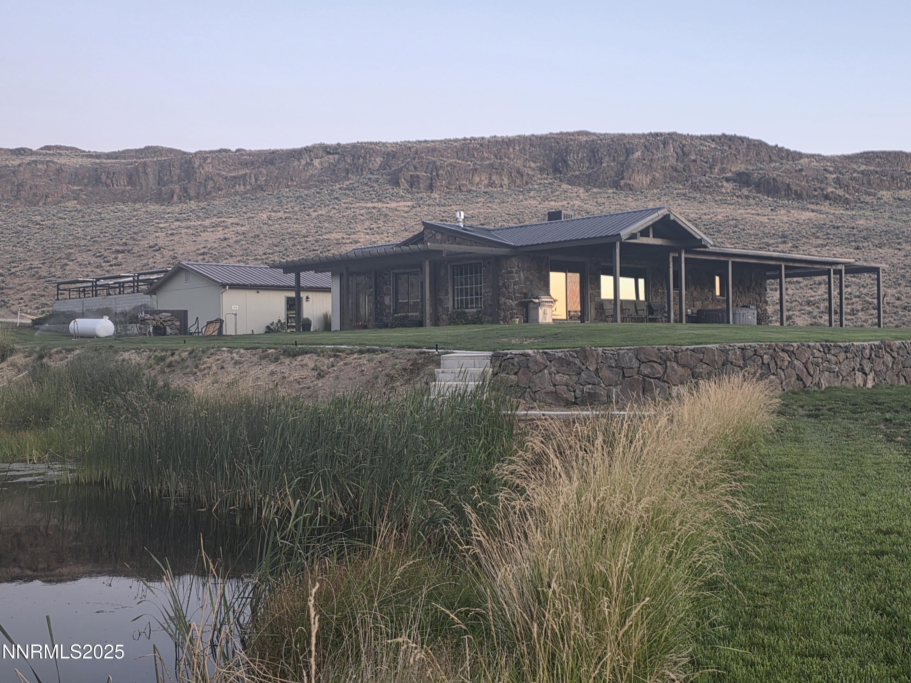 3300 High Rock Road Gerlach, NV 89412 - Photo 23 of 57 a front view of a house with a yard