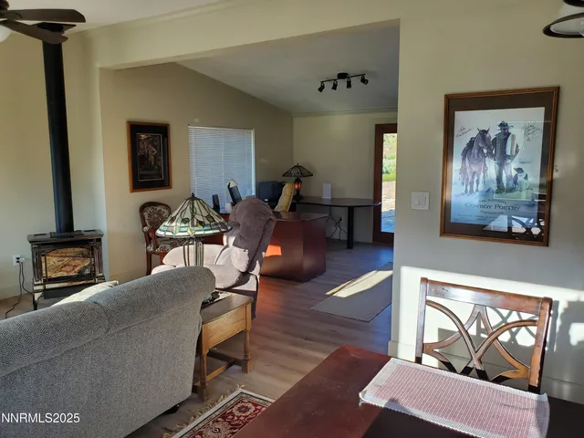 a view of a dining room with furniture and a window