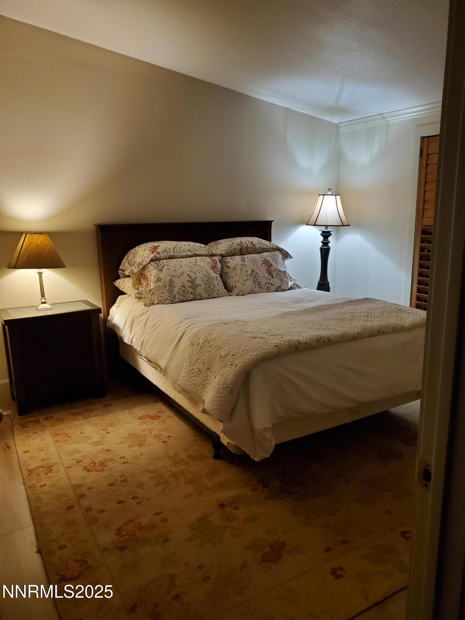 3300 High Rock Road Gerlach, NV 89412 - Photo 26 of 57 a bedroom with bed and a night stand