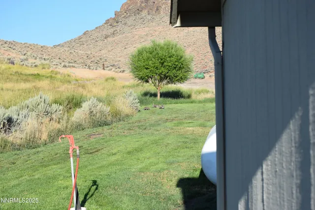a view of a large building with a yard