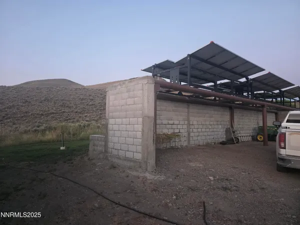a view of outdoor space with wooden fence