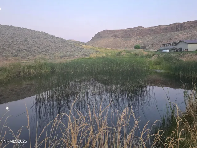 a view of a lot of a house with a yard