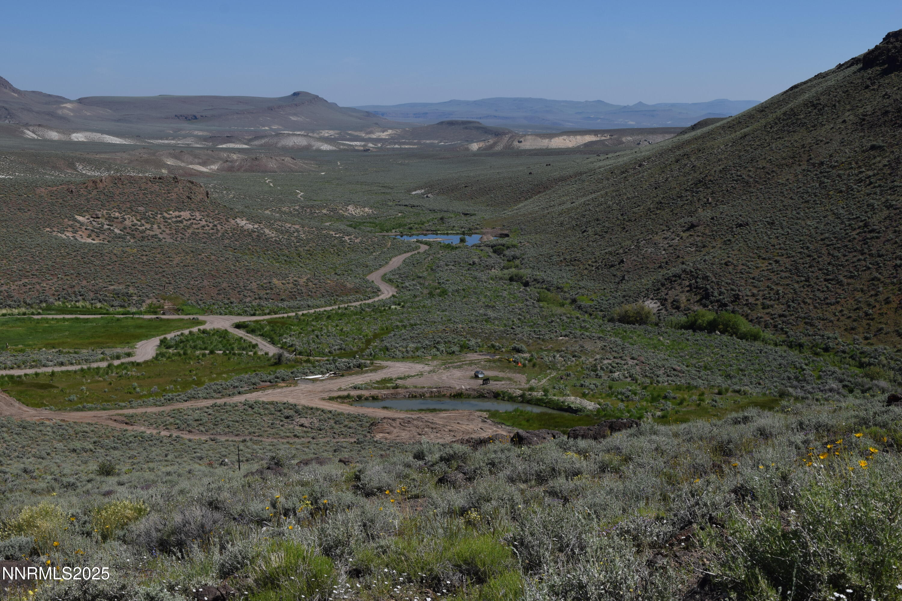 3300 High Rock Road Gerlach, NV 89412 - Photo 5 of 57 a view of a mountain with a field