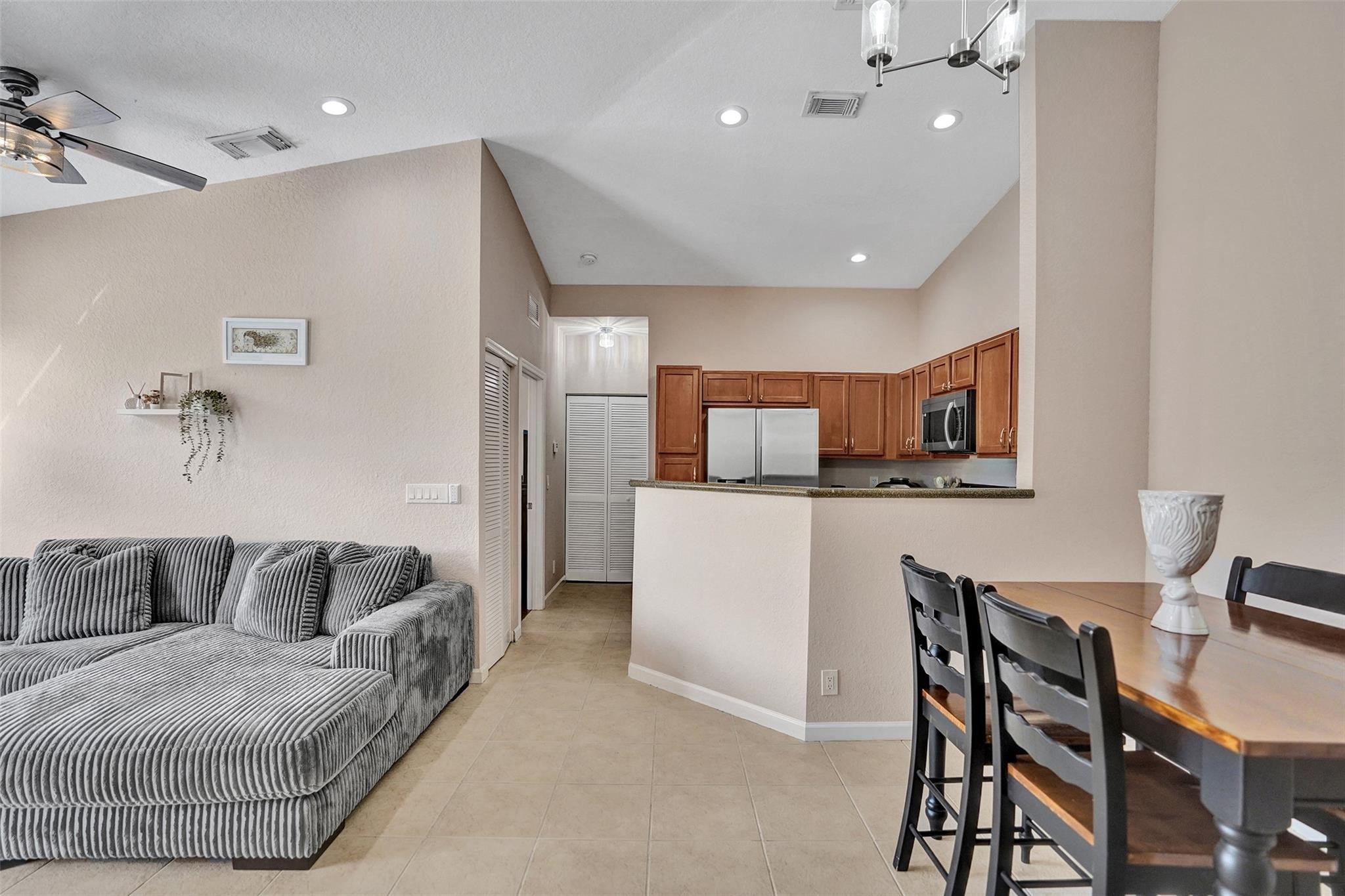 1825 Sonrisa Street Riviera Beach, FL 33404 - Photo 11 of 50 a living room with furniture and kitchen view