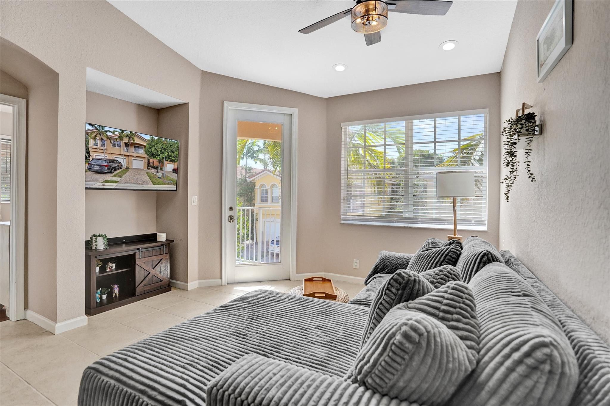 1825 Sonrisa Street Riviera Beach, FL 33404 - Photo 12 of 50 a bed sitting in a bedroom next to a window