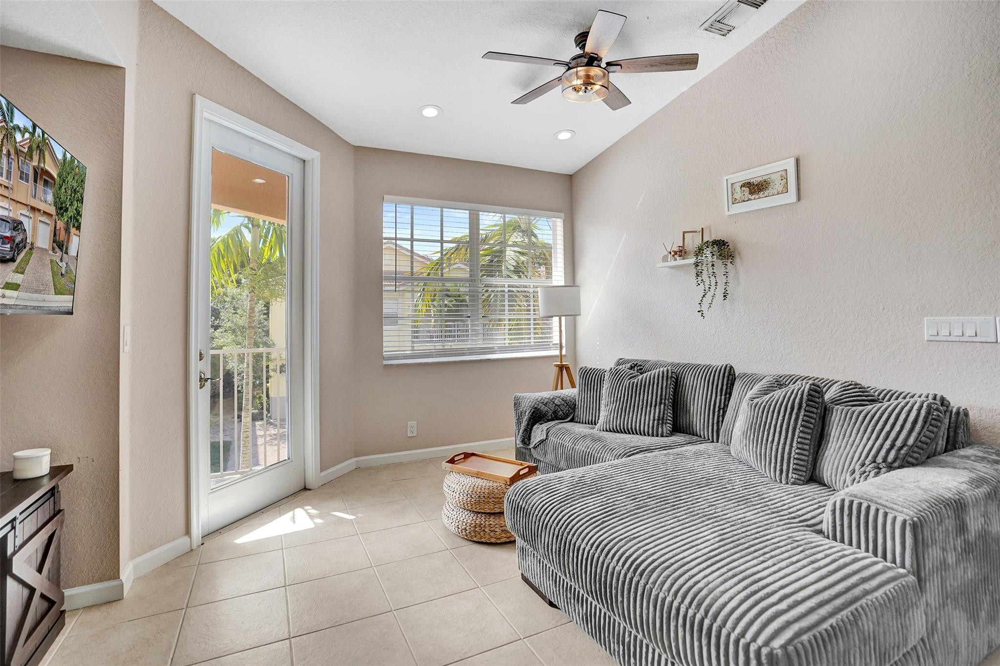 1825 Sonrisa Street Riviera Beach, FL 33404 - Photo 13 of 50 a bedroom with a large bed and a window