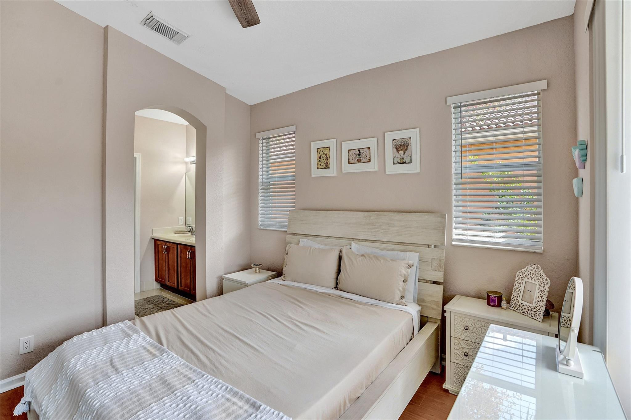 1825 Sonrisa Street Riviera Beach, FL 33404 - Photo 17 of 50 a bedroom with a bed and a window