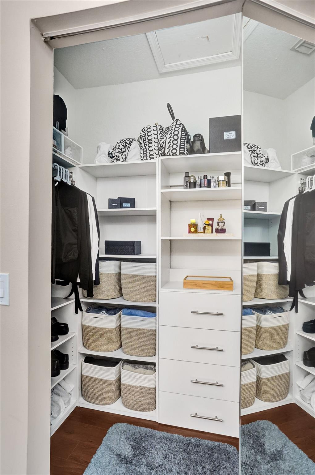 1825 Sonrisa Street Riviera Beach, FL 33404 - Photo 20 of 50 a view of walk in closet with clothes and shoes