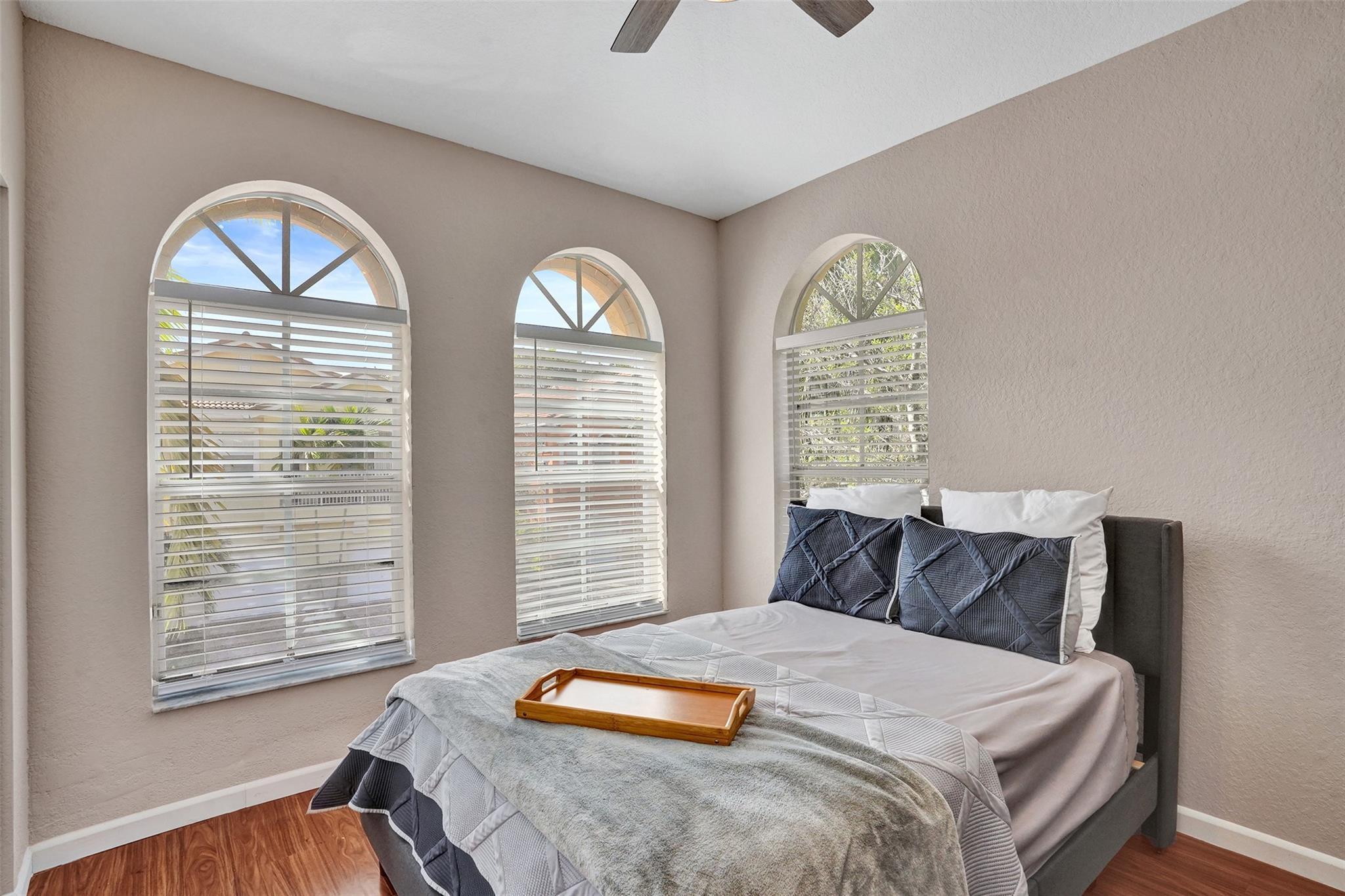 1825 Sonrisa Street Riviera Beach, FL 33404 - Photo 22 of 50 a bedroom with a bed and a large window