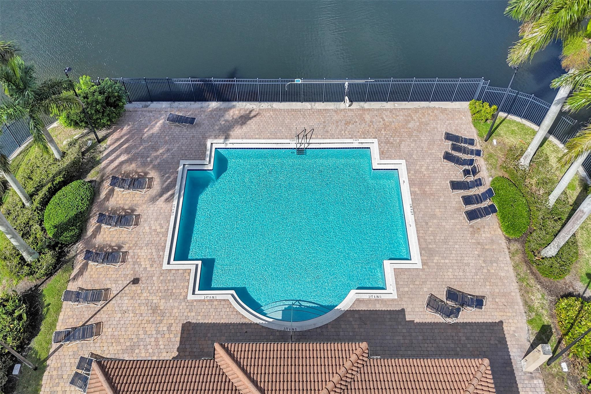 1825 Sonrisa Street Riviera Beach, FL 33404 - Photo 36 of 50 a view of a patio with couches and potted plants