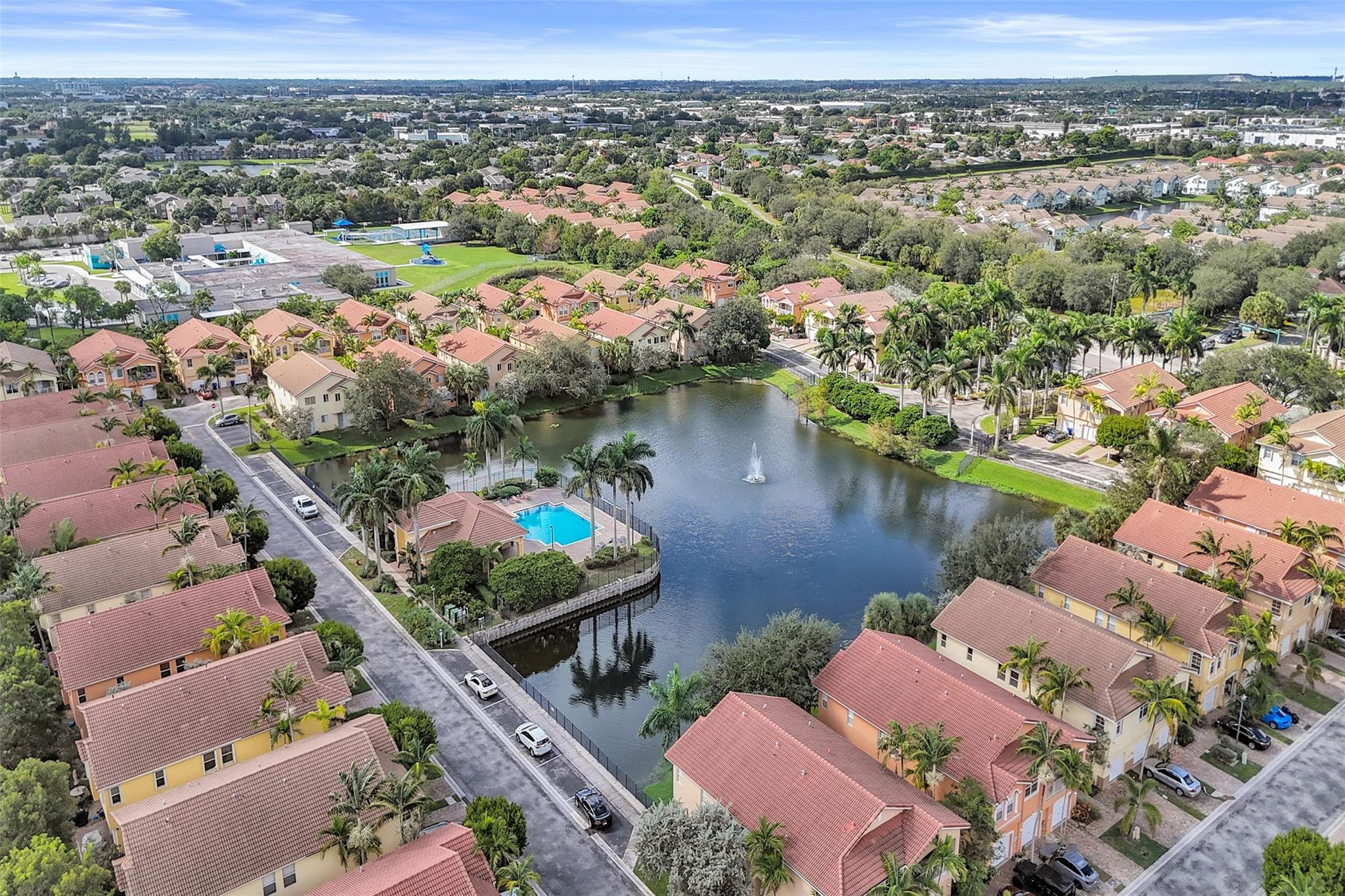 1825 Sonrisa Street Riviera Beach, FL 33404 - Photo 39 of 50 an aerial view of lake and residential houses with outdoor space