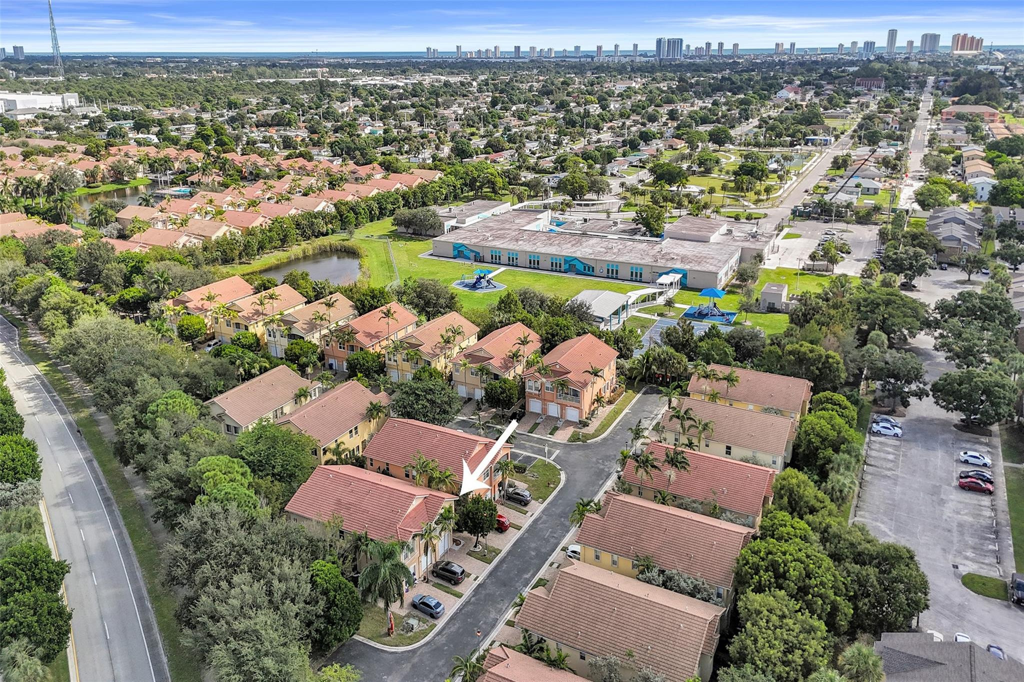 1825 Sonrisa Street Riviera Beach, FL 33404 - Photo 42 of 50 an aerial view of residential houses with outdoor space