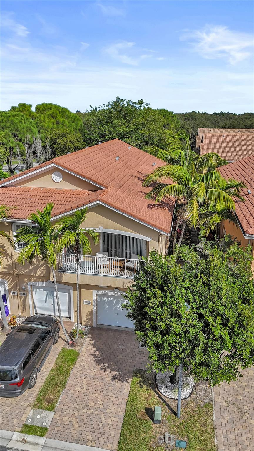 1825 Sonrisa Street Riviera Beach, FL 33404 - Photo 43 of 50 a view of a garden with a patio