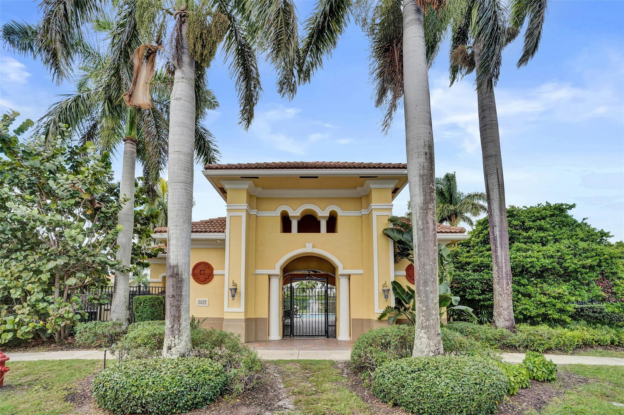1825 Sonrisa Street Riviera Beach, FL 33404 - Photo 45 of 50 a front view of a house with garden
