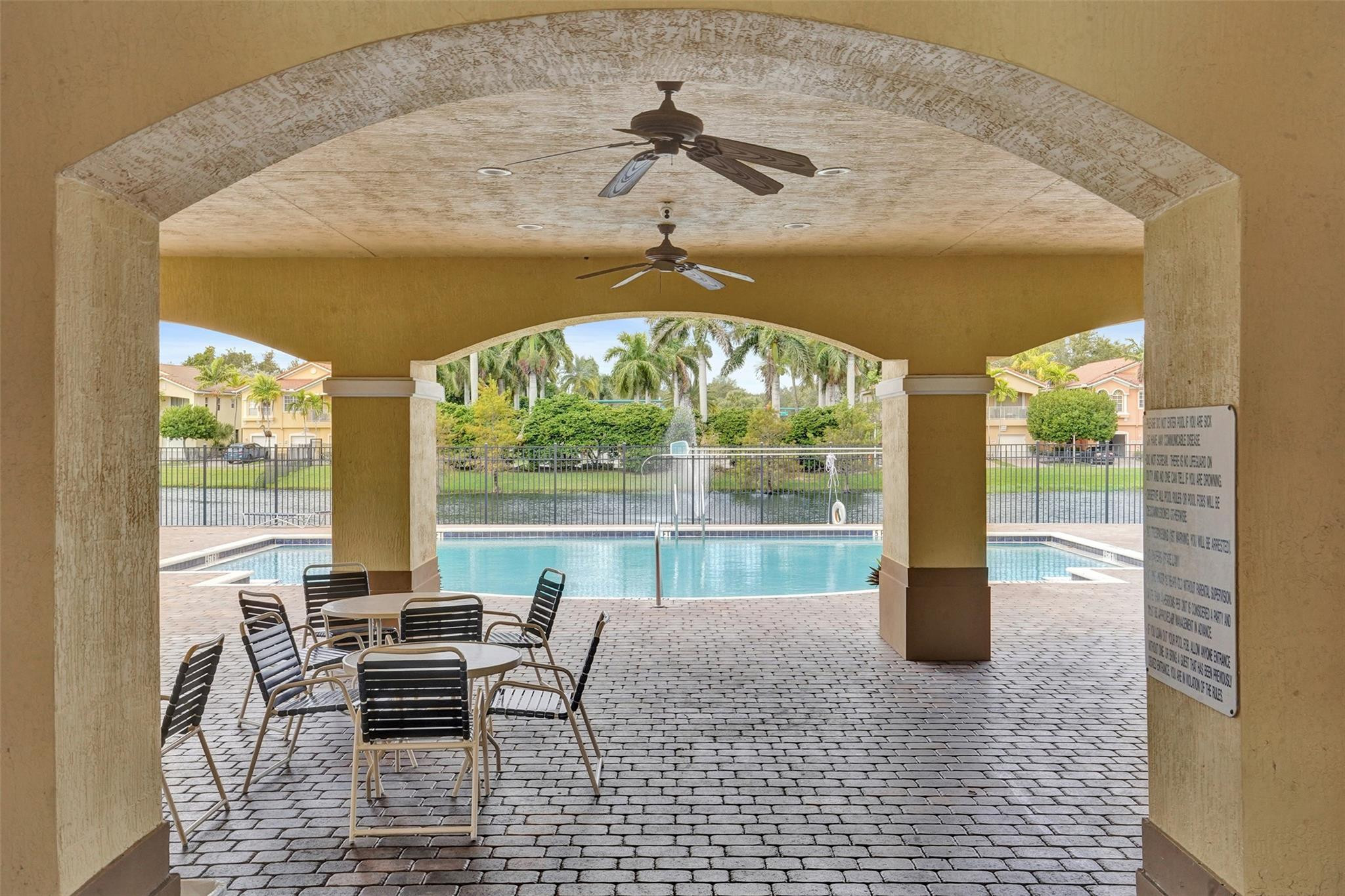 1825 Sonrisa Street Riviera Beach, FL 33404 - Photo 46 of 50 a dining room with furniture and a floor to ceiling window