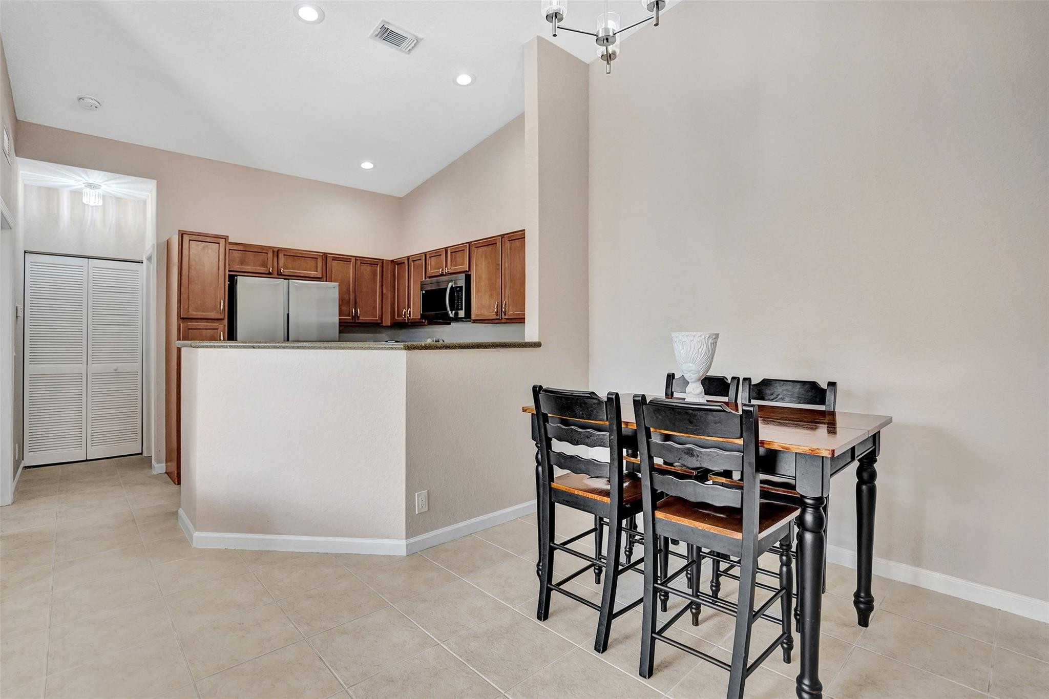 1825 Sonrisa Street Riviera Beach, FL 33404 - Photo 7 of 50 a view of a dining room with furniture