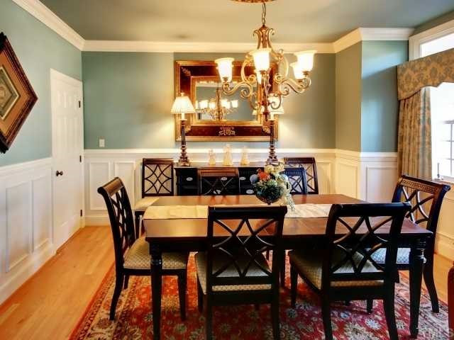 13709 Possum Track Road Raleigh, NC 27614 - Photo 2 of 12 Formal Dining Room features custom painting, site finished hardwood floors, and most of all custom wainscoating trim! Enjoy entertaining from this room any time of the year! Enough space for all of your favorite furniture! Dining Room