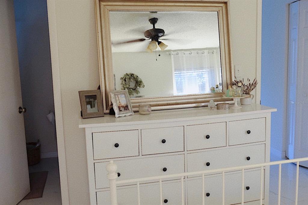 10659 Windsor Court Orlando, FL 32821 - Photo 13 of 15 a bathroom with a sink and a mirror