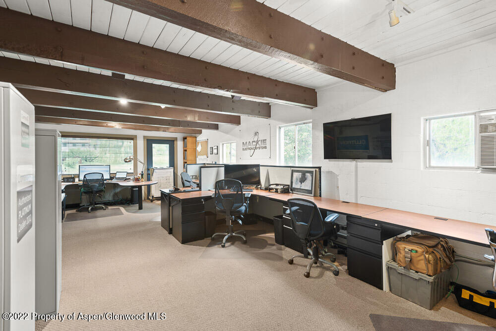 2459 Emma Road Basalt, CO 81621 - Photo 20 of 31 a view of a livingroom with workspace and a window