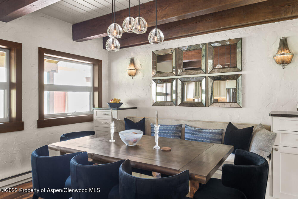 2459 Emma Road Basalt, CO 81621 - Photo 9 of 31 a view of a dining room with furniture a chandelier and wooden floor