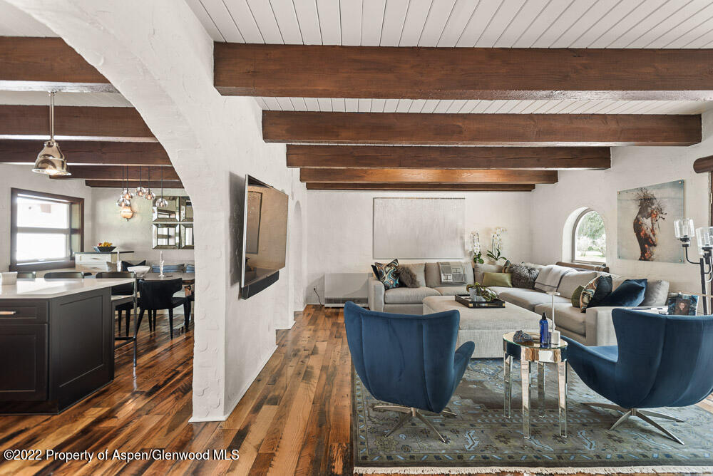 2459 Emma Road Basalt, CO 81621 - Photo 10 of 31 a living room with furniture a flat screen tv and kitchen view