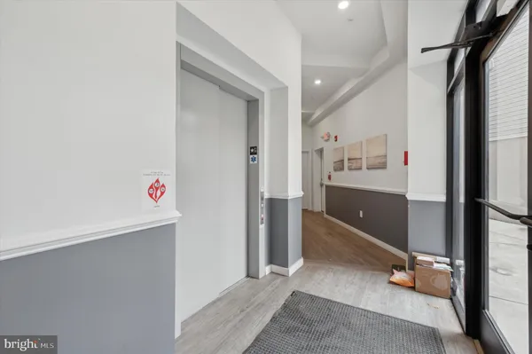 a room with gym equipment and a view of living room