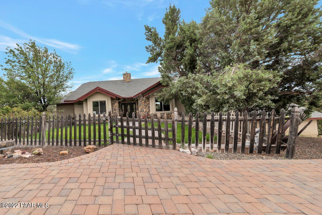 5755 West Rambling Road Prescott, AZ 86305 - Photo 1 of 22 a front view of a house with a garden